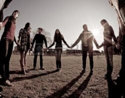 People holding hands in a circle