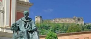 A view of the statue of Bernardino Telesio - a famous Renaissance Philosopher and Theologian from Cosenza - with the Swabian Castle in the background